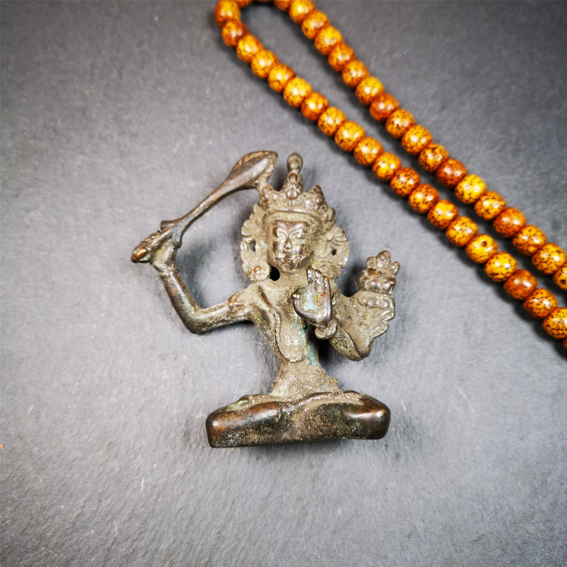 This Manjusri statue was collected from Samye Monastray, the first monastery in Tibet,and important Nyingma monsatery. It's an old-fashioned manjusri statue,about 60 years old,made of thokcha. Manjusri is a bodhisattva associated with prajna (insight) in Mahayana Buddhism. In Tibetan Buddhism, he is also a yidam. His name means "Gentle Glory" in Sanskrit.