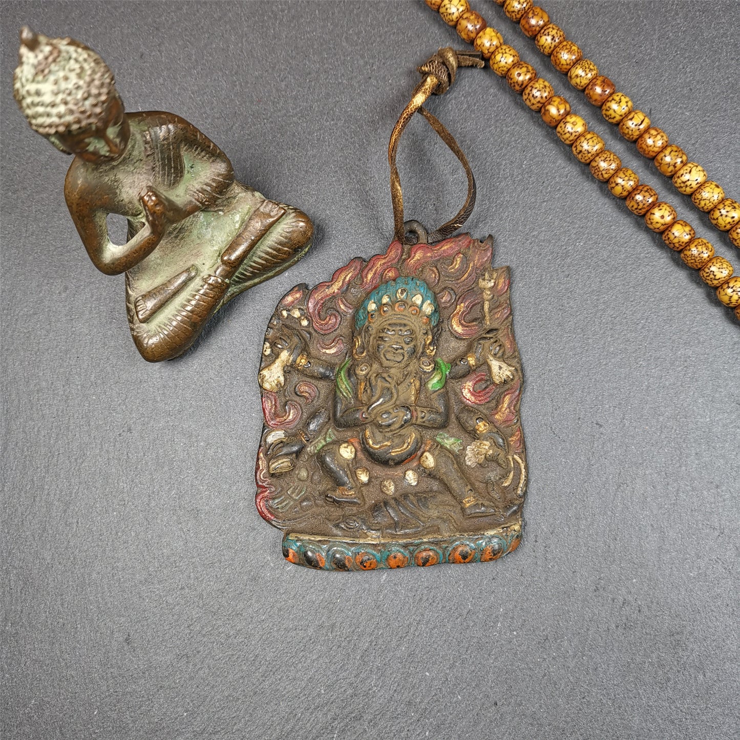 This Mahakala badge was collected from Jiegu Monastery,Tibet, about 40 years old. It is made of copper, painted with mineral pigments,height is 3.55 inches. Mahakala appears as a protector deity known as a dharmapala in Vajrayana Buddhism, particularly most Tibetan traditions as Citipati, and in Shingon Buddhism.