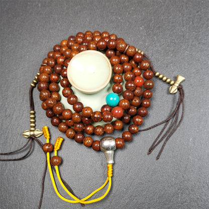 This old lotus seed mala was handmade from tibetan crafts man in Baiyu County,about 30 years old,blessed by lama. It's composed of 108 pcs 8mm lotus seed beads,then add some old agate,turquoise beads,1 pair of copper bead counters,and white copper guru bead on it.