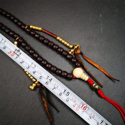 This mala is made by Tibetan craftsmen and come from Hepo Town, Baiyu County,Tibet, the birthplace of the famous Tibetan handicrafts,about 30 years old,blessed by a lama in Baiyu Monastery. It's made of lotus seed beads,brown color,with 1 pair of copper bead counters, and a cold iron skull bead on the tail.