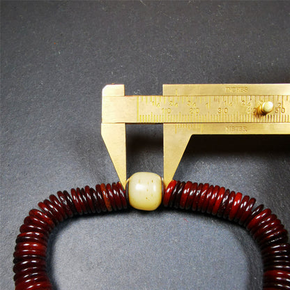 This bone carved mala beads is made by Tibetan craftsmen and come from Hepo Town, Baiyu County. It has 108 flat shape beads,1 spacer bead,and 1 guru bead,all hand carved with tibetan yak bone.