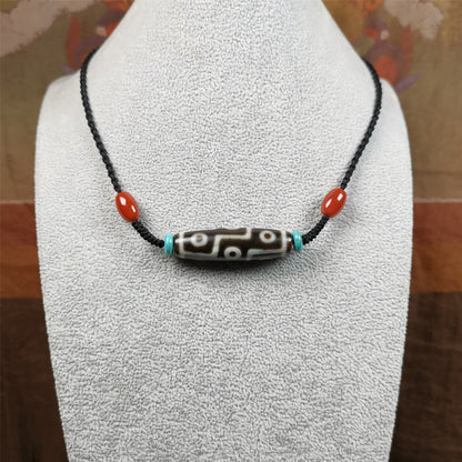 This 9 eyes dzi necklace was hand-woven by Tibetans from Baiyu County, the main bead is a 9 eyed  dzi bead, paired with 2 small agate beads and 2 turquoise spacer beads,about 30 years old.