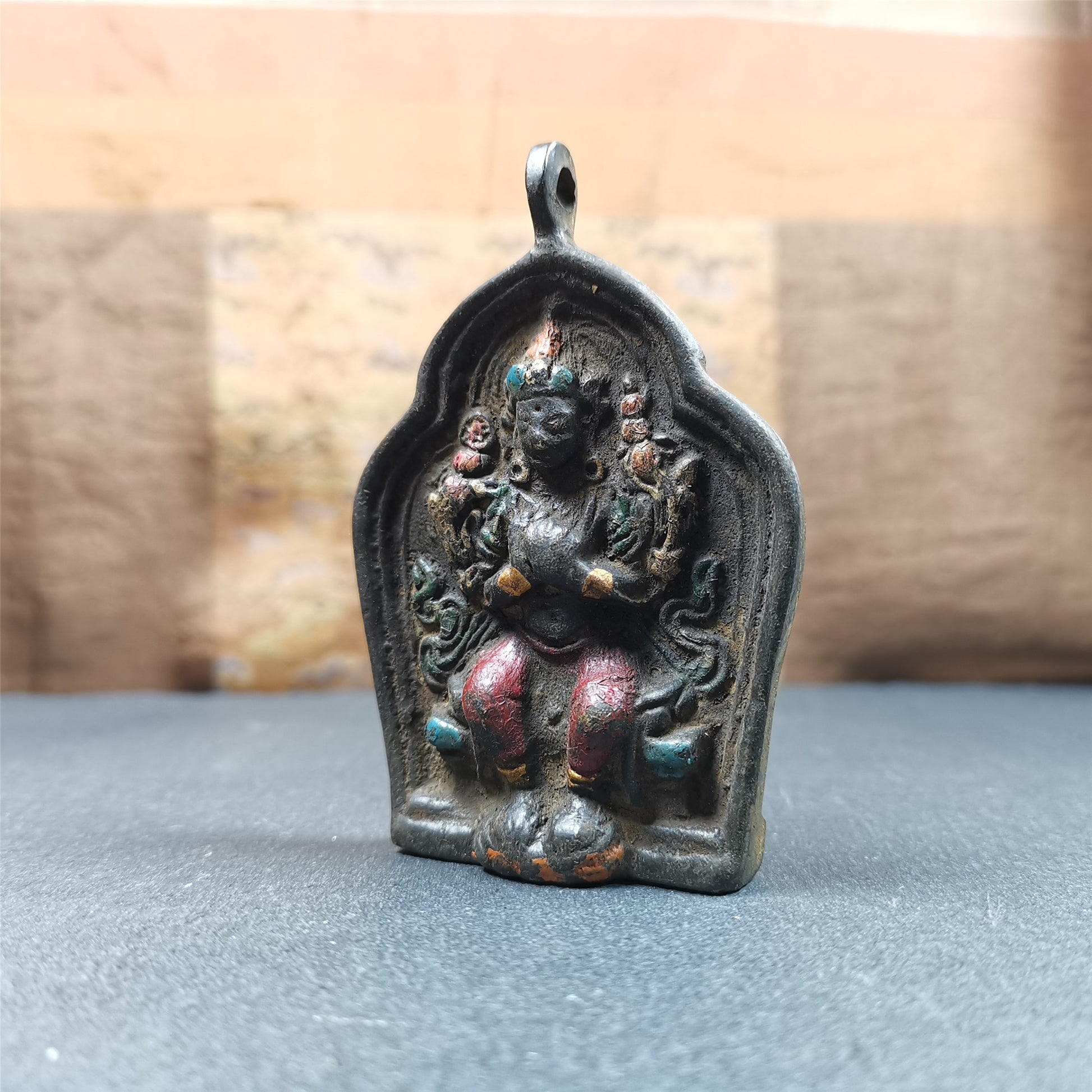 This maitreya statue was collected from Labrang Monastery,Qinghai,about 80 years old. It is an amulet of maitreya,made of copper,painted with mineral pigments,size is 2.95 by 1.97 inches,about 80 years old.