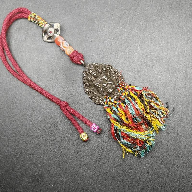 Thokcha Amulet,Mahakala Pendant, Buddhist Protector - Tibetan Buddhist amulet, close-up detail