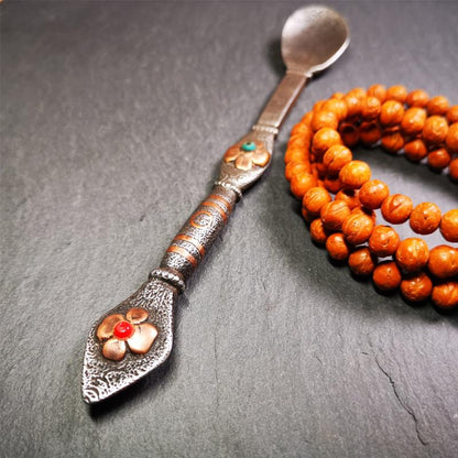 This offering spoon is handmade by Tibetan craftsmen from Hepo Town, Baiyu County,the birthplace of the famous Tibetan handicrafts. It is entirely hand-carved with cold iron and copper,lenght about 7.1 inches. You can see teh intricate engraved detail along the handle, neck and bowl,very beautiful. Religious dharma tool used in Buddhist shrine.