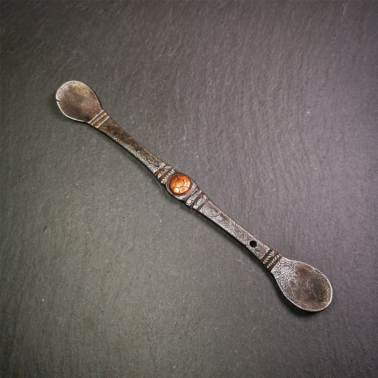 This offering spoon is handmade by Tibetan craftsmen from Hepo Town, Baiyu County,the birthplace of the famous Tibetan handicrafts. It is entirely hand-carved with cold iron and copper,lenght about 7.5 inches. You can see teh intricate engraved detail along the handle, neck and bowl,very beautiful. Religious dharma tool used in Buddhist shrine.