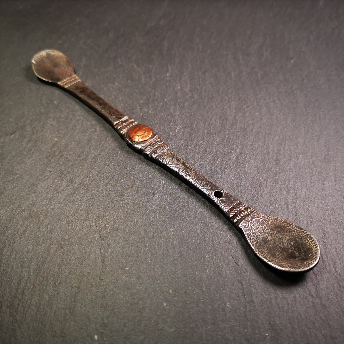 This offering spoon is handmade by Tibetan craftsmen from Hepo Town, Baiyu County,the birthplace of the famous Tibetan handicrafts. It is entirely hand-carved with cold iron and copper,lenght about 7.5 inches. You can see teh intricate engraved detail along the handle, neck and bowl,very beautiful. Religious dharma tool used in Buddhist shrine.