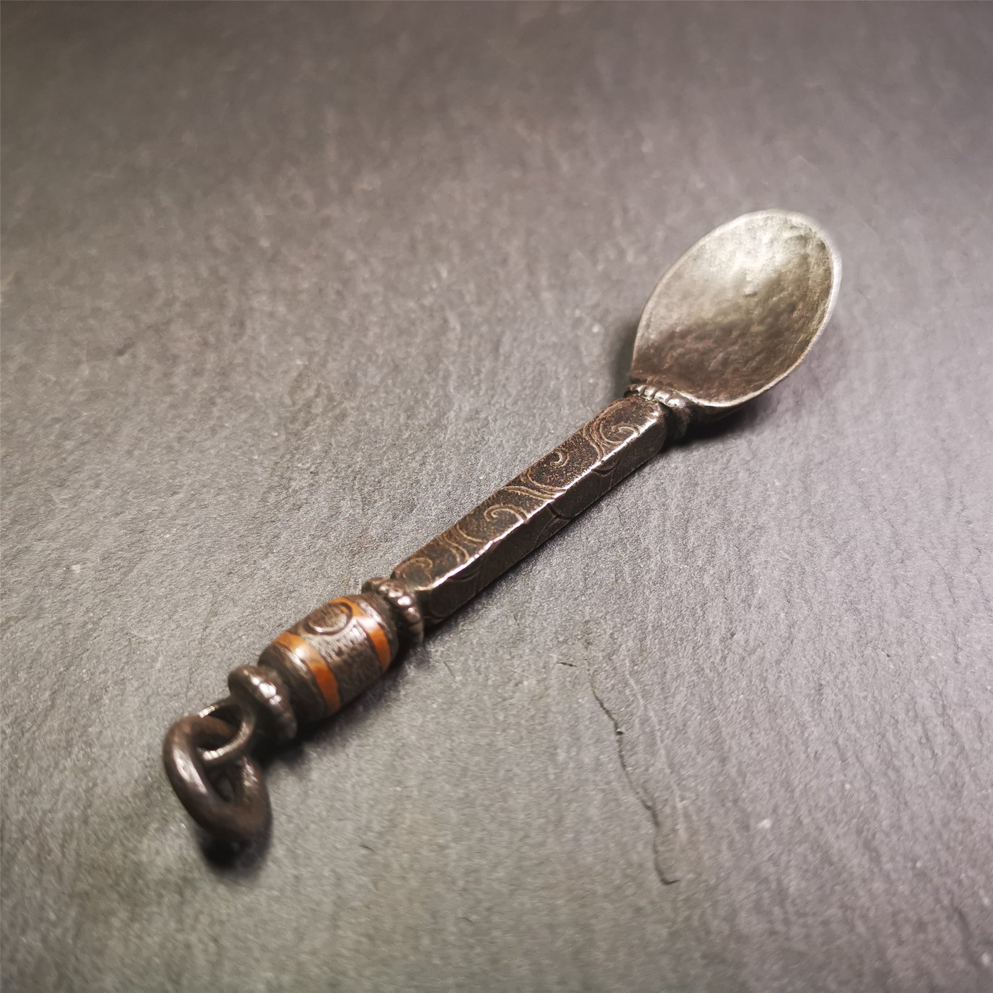 This offering spoon is handmade by Tibetan craftsmen from Hepo Town, Baiyu County,the birthplace of the famous Tibetan handicrafts. It is entirely hand-carved with cold iron and copper,lenght about 4.0 inches.