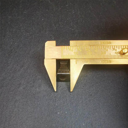 Stupa Amulet 1.22" - Tibetan Buddhist amulet, size reference