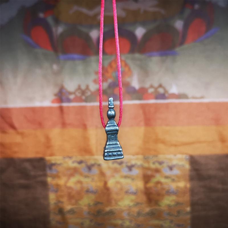 This stupa amulet pendant wss hand carved by Tibetan craftsmen from Tibet in 1990's. From Hepo Town, Baiyu County, the birthplace of the famous Tibetan handicrafts. It was made of cold iron,black color,1.22 inches heiht. You can make it necklace pendant,mala pendant,keychain, or just put it on your desk,as an ornament.