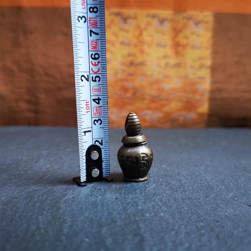 This beautiful stupa gau shrine was hand carved by Tibetan craftsmen from Tibet in 1990's. From Hepo Town, Baiyu County, the birthplace of the famous Tibetan handicrafts. It has OM MANI PADME HUM mantra engraved on its side, The top bottle cap can be opened and you can place offerings inside,like pills or zung Consecration. You can make it into a necklace, or a keychain, or just put it in your shrine or altar.