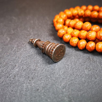 This beautiful stupa pendant is hand carved by Tibetan craftsmen from Tibet in 2000's. From Hepo Town, Baiyu County, the birthplace of the famous Tibetan handicrafts. It was made of cold iron,black color,1.38 inches height, a cross vajra seal at the bottom.  You can make it into a pendant, or a keychain, or put it in your shrine.