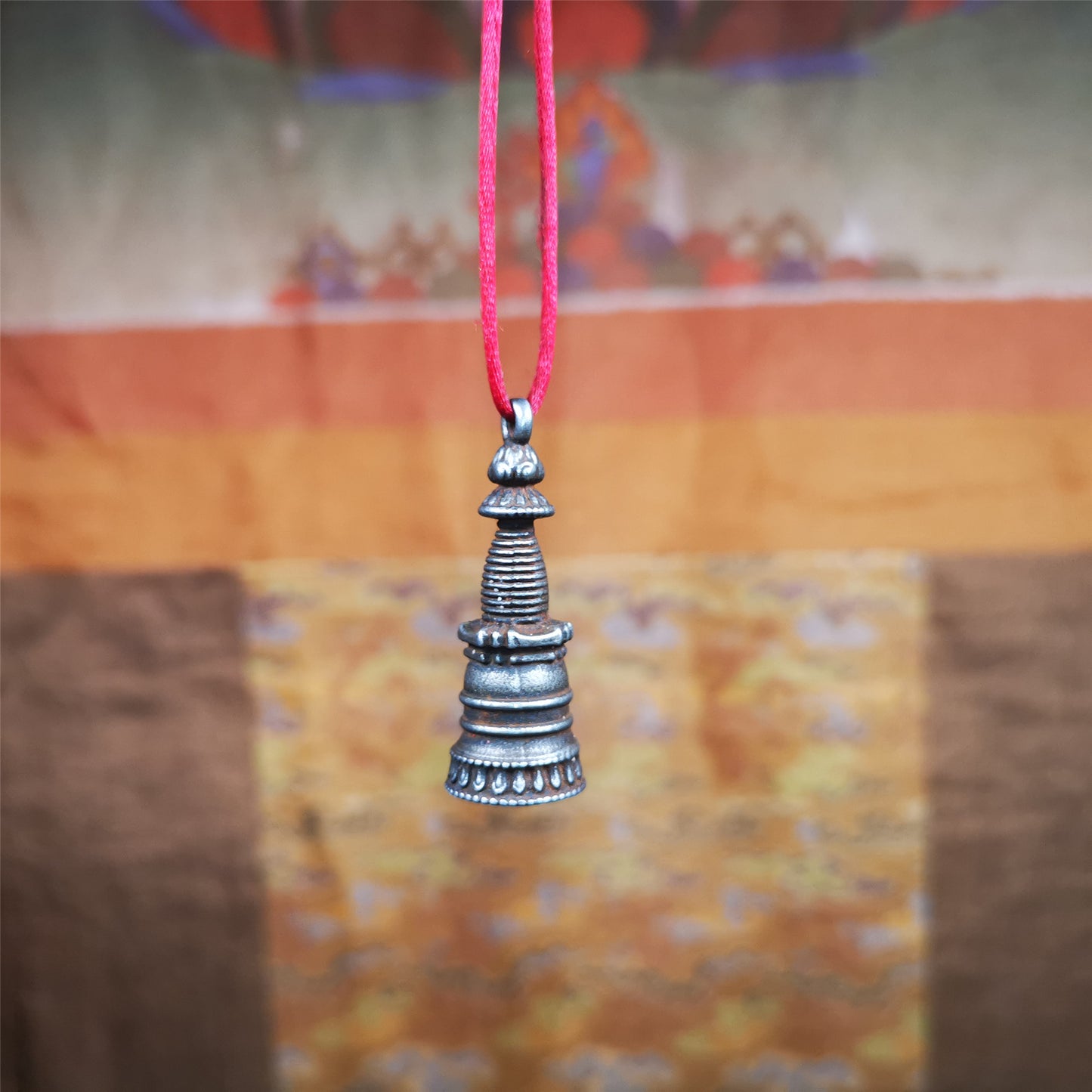 This beautiful stupa pendant is hand carved by Tibetan craftsmen from Tibet in 2000's. From Hepo Town, Baiyu County, the birthplace of the famous Tibetan handicrafts. It was made of cold iron,black color,1.38 inches height, a cross vajra seal at the bottom.  You can make it into a pendant, or a keychain, or put it in your shrine.