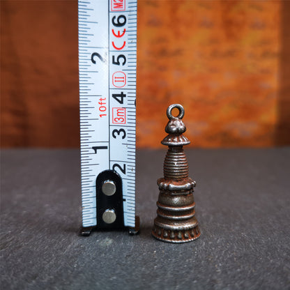 This beautiful stupa pendant is hand carved by Tibetan craftsmen from Tibet in 2000's. From Hepo Town, Baiyu County, the birthplace of the famous Tibetan handicrafts. It was made of cold iron,black color,1.38 inches height, a cross vajra seal at the bottom.  You can make it into a pendant, or a keychain, or put it in your shrine.