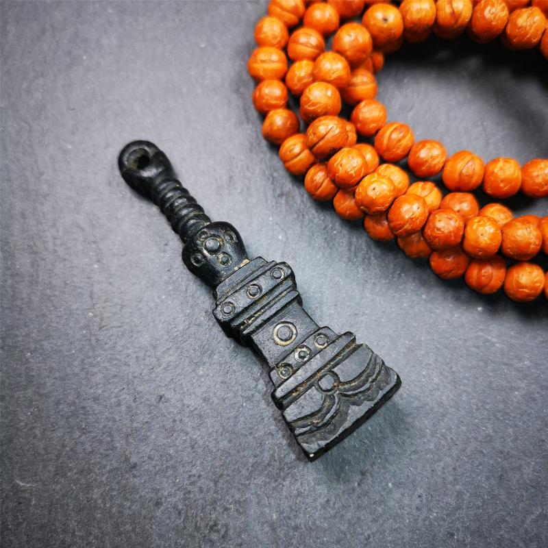 This beautiful stupa pendant is hand carved by Tibetan craftsmen from Tibet in 2000's. From Hepo Town, Baiyu County, the birthplace of the famous Tibetan handicrafts. It was made of obsidian, all black color,2.95 inches height. At the bottom of it is engraved with the Tibetan word OM.