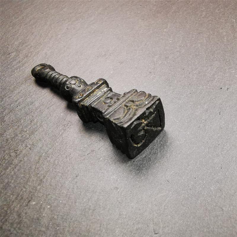 This beautiful stupa pendant is hand carved by Tibetan craftsmen from Tibet in 2000's. From Hepo Town, Baiyu County, the birthplace of the famous Tibetan handicrafts. It was made of obsidian, all black color,2.95 inches height. At the bottom of it is engraved with the Tibetan word OM.