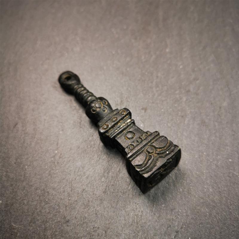 This beautiful stupa pendant is hand carved by Tibetan craftsmen from Tibet in 2000's. From Hepo Town, Baiyu County, the birthplace of the famous Tibetan handicrafts. It was made of obsidian, all black color,2.95 inches height. At the bottom of it is engraved with the Tibetan word OM.