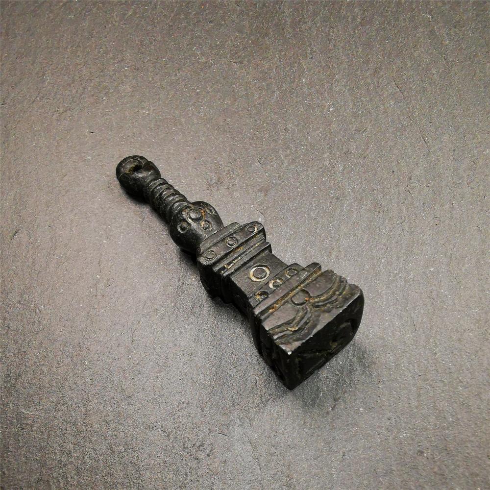 This beautiful stupa pendant is hand carved by Tibetan craftsmen from Tibet in 2000's. From Hepo Town, Baiyu County, the birthplace of the famous Tibetan handicrafts. It was made of obsidian, all black color,2.95 inches height. At the bottom of it is engraved with the Tibetan word OM.