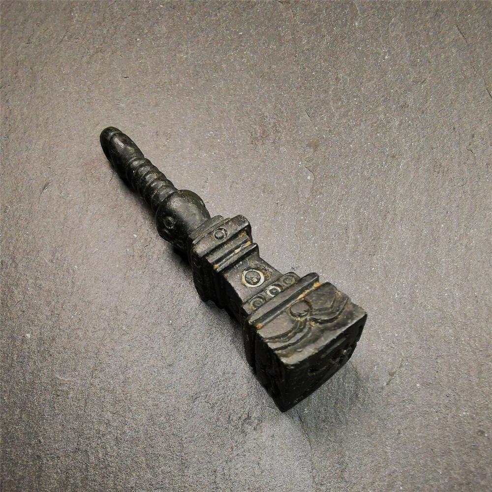 This beautiful stupa pendant is hand carved by Tibetan craftsmen from Tibet in 2000's. From Hepo Town, Baiyu County, the birthplace of the famous Tibetan handicrafts. It was made of obsidian, all black color,2.95 inches height. At the bottom of it is engraved with the Tibetan word OM.