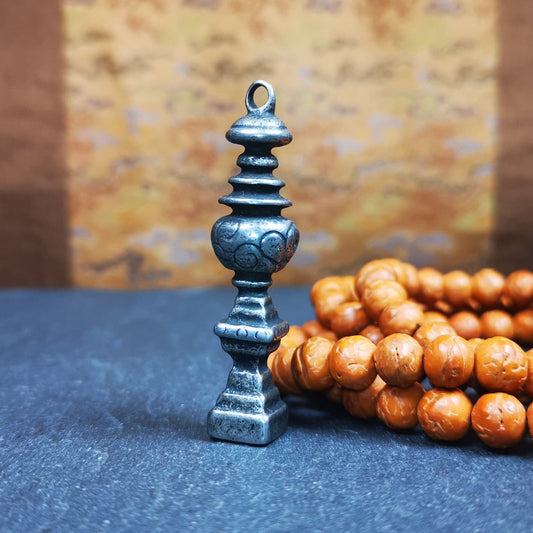 This beautiful stupa pendant is hand carved by Tibetan craftsmen from Tibet in 1990's. From Hepo Town, Baiyu County, the birthplace of the famous Tibetan handicrafts. It was made of cold iron,inlaid copper dot,2.16 inches height,0.51 inch width. You can make it a pendant, or put it in your shrine.