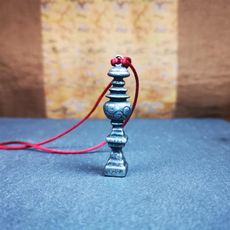 This beautiful stupa pendant is hand carved by Tibetan craftsmen from Tibet in 1990's. From Hepo Town, Baiyu County, the birthplace of the famous Tibetan handicrafts. It was made of cold iron,inlaid copper dot,2.16 inches height,0.51 inch width. You can make it a pendant, or put it in your shrine.