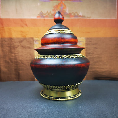 This type of tibetan offering bowls was handmade by Tibetan craftsmen from Tibet in 2000's.From Hepo Town, Baiyu County, the birthplace of the famous Tibetan handicrafts. It is hand carved from a single piece of Shesum wood,carved into stupa shape,and decorated with brass patterns,size is 6.3" × 4.0”.