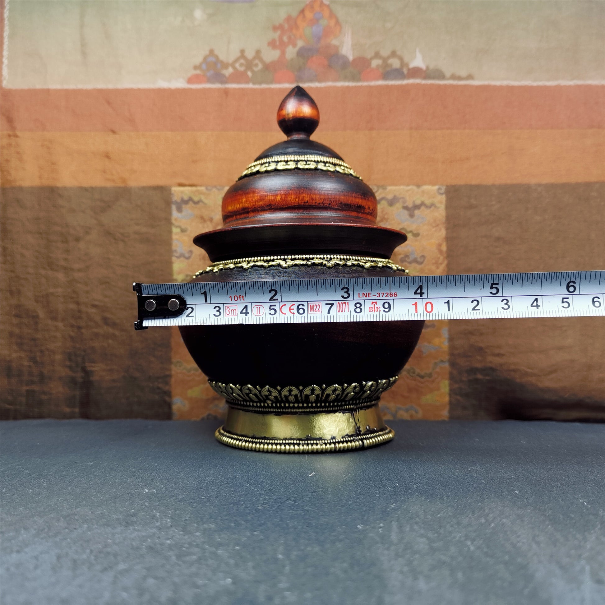 This type of tibetan offering bowls was handmade by Tibetan craftsmen from Tibet in 2000's.From Hepo Town, Baiyu County, the birthplace of the famous Tibetan handicrafts. It is hand carved from a single piece of Shesum wood,carved into stupa shape,and decorated with brass patterns,size is 6.3" × 4.0”.