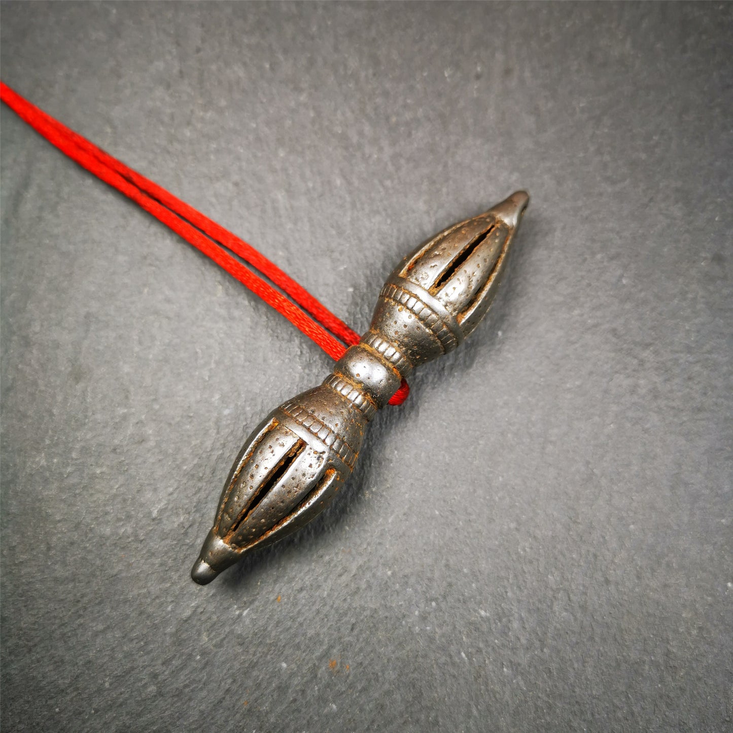 This vajra were handmade by Tibetan craftsmen from Tibet in 1990's,from Hepo Town, Baiyu County, the birthplace of the famous Tibetan handicrafts. It is nine-pronged vajra,made of cold iron,3.07 inches length.  You can make it a pendant, or put in your shrine.