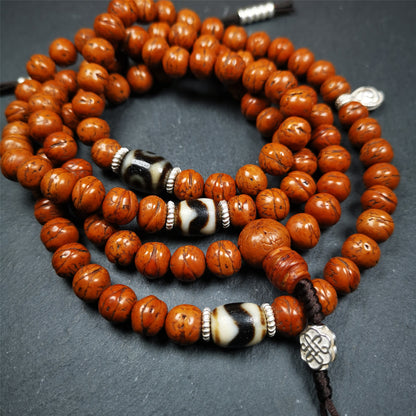 This old bodhi seed beads mala was collected from Derge county,hold and blessed by a lama in Gengqing monastery, about 30 years old.  It is composed of 108 bodhi seed beads, and is equipped with 3 dzi beads, silver spacer beads, bead counters and maini jewel clip,and finally consists a lucky knot bead on the end, very elegant.