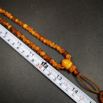 This skull mala was handmade by Tibetan craftsmen.  It is made of yak bone, yellow color,108 skull beads diameter of 7mm / 0.27",circumference is 66cm / 26" ,  end of a yak bone buddha shape guru bead.