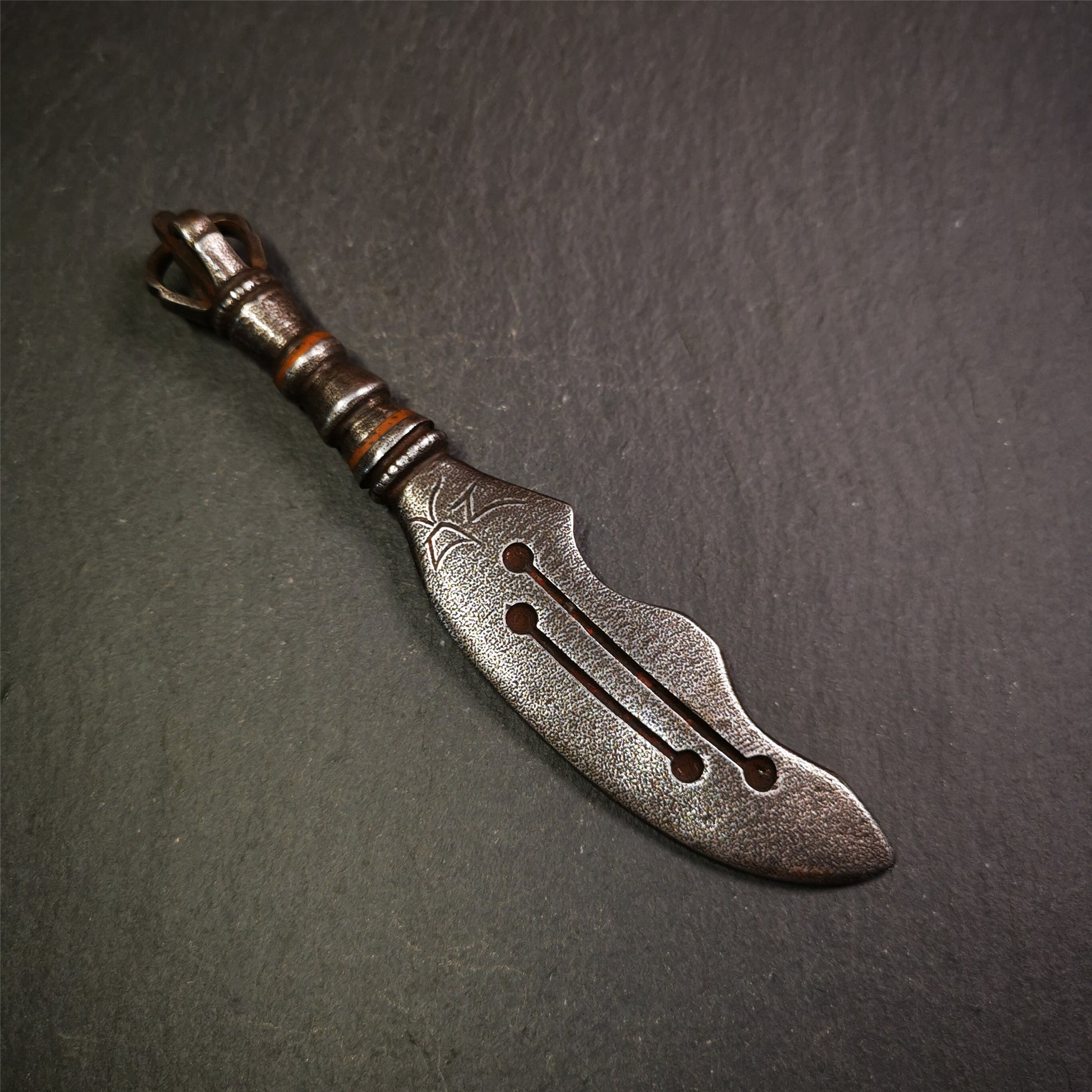 This machete knife is handmade by Tibetan craftsmen from Tibet in 2000s,from Hepo Town, Baiyu County, the birthplace of the famous Tibetan handicrafts.  It's made of cold iron,inlaid red copper wire, and the half vajra at the tail