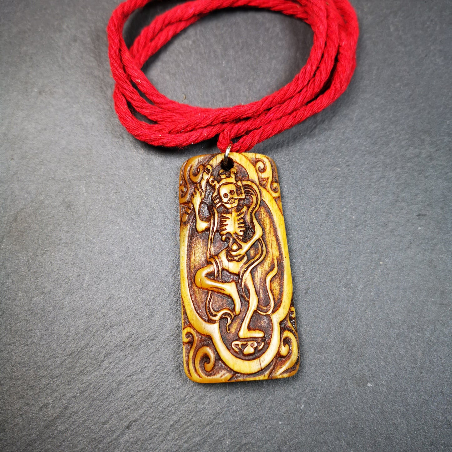 This beautiful bone carved Chitipati skull amulet is hand carved by Tibetan craftsmen . It is Masters of Sitavana, entirely hand-carved of yak bone,wears a crown with 3 skulls,size is 2.3 inches