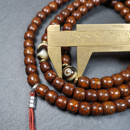  This old lotus seed mala was handmade from tibetan crafts man in Baiyu County,about 30 years old. It's composed of 108 lotus seed beads,then add some dzi beads,1 pair of silver bead counters,and ivory guru bead on i