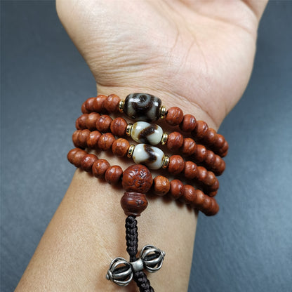This bodhi beads mala is made by Tibetan craftsmen and come from Hepo Town, Baiyu County, the birthplace of the famous Tibetan handicrafts,about 30 years old, hold and blessed by a lama in Baiyu Monastery.  It is composed of 108 bodhi seed beads, and is equipped with 3 dzi beads, silver bead counters are installed on both sides, 1 mantra dots bead clip,and finally consists a silver vajra on the end, very elegant.