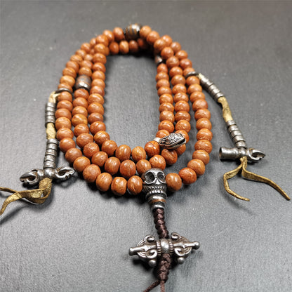 This bodhi beads mala is made by Tibetan craftsmen and come from Hepo Town, Baiyu County, the birthplace of the famous Tibetan handicrafts,about 30 years old, hold and blessed by a lama in Baiyu Monastery.  It is composed of 108 bodhi seed beads, and is equipped with 3 cold iron dzi beads, cold iron bead counters are installed on both sides, 1 mani jewel bead clip,and finally consists a skull guru bead and vajra on the end, very elegant.