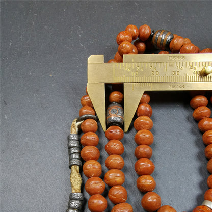 This bodhi beads mala is made by Tibetan craftsmen and come from Hepo Town, Baiyu County, the birthplace of the famous Tibetan handicrafts,about 30 years old, hold and blessed by a lama in Baiyu Monastery.  It is composed of 108 bodhi seed beads, and is equipped with 3 cold iron dzi beads, cold iron bead counters are installed on both sides, 1 mani jewel bead clip,and finally consists a skull guru bead and vajra on the end, very elegant.