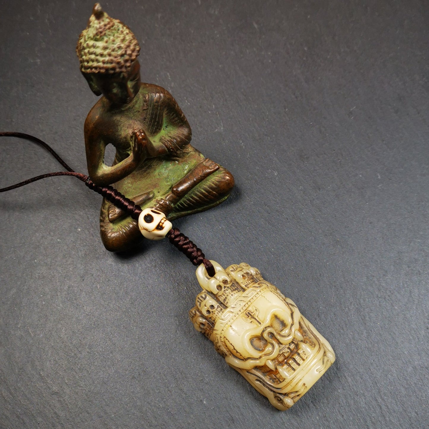 This beautiful bone skull amulet is hand carved by Tibetan craftsmen from Hepo Town, Baiyu County, the birthplace of the famous Tibetan handicrafts. It is Masters of Sitavana, entirely hand-carved of yak bone,wears a crown with 5 skulls,size is 2.3 inches,very beautiful. You can use it as a pendant, or bag hanging,or put it into your shrin