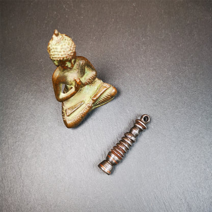 This beautiful stupa pendant is hand carved by Tibetan craftsmen from Tibet in 1990s. It was made of cold iron,inlaid copper dot,2.1 inches height,0.47 inch width. You can make it a pendant, or put it in your shrine.