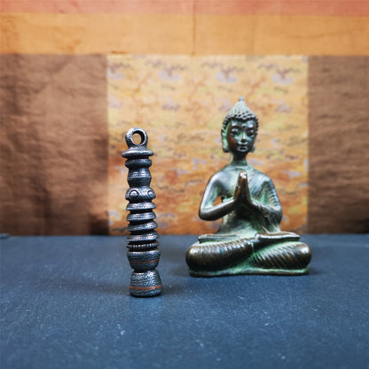 This beautiful stupa pendant is hand carved by Tibetan craftsmen from Tibet in 1990s. It was made of cold iron,inlaid copper dot,2.1 inches height,0.47 inch width. You can make it a pendant, or put it in your shrine.