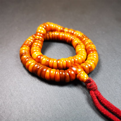 This bone carved mala beads is made by Tibetan,about 30 years Old. It has 108 wave shape beads,1 guru bead,all hand carved with tibetan yak bone. It reflects the original ascetic state of the original ecology, very simple and full of sense of time