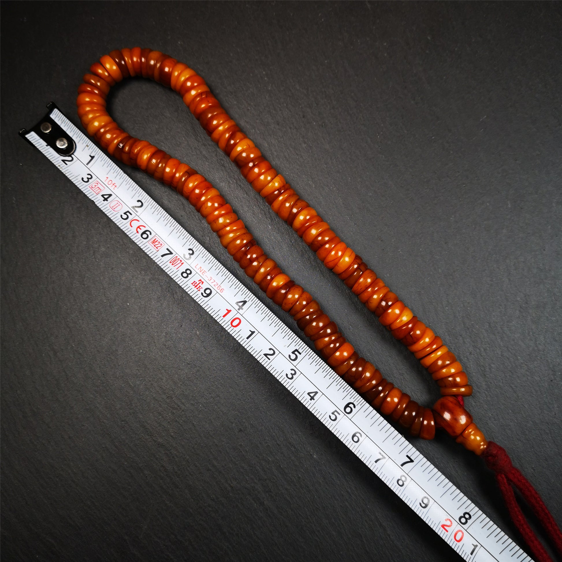 This bone carved mala beads is made by Tibetan,about 30 years Old. It has 108 wave shape beads,1 guru bead,all hand carved with tibetan yak bone. It reflects the original ascetic state of the original ecology, very simple and full of sense of time