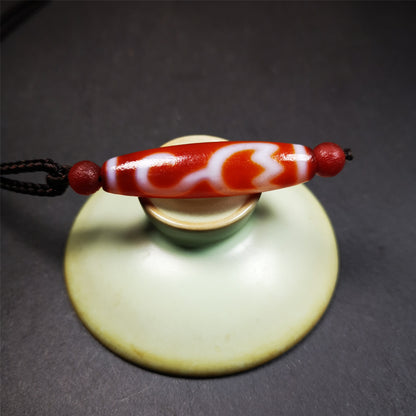 This vintage Lotus Dzi Bead is made of fire agate,new but high quality,size is 1.9" × 0.5". The lotus is the symbol of what is divine or immortal in humanity, and is also a symbol of divine perfection. The lotus is the attribute of sun and fire gods.