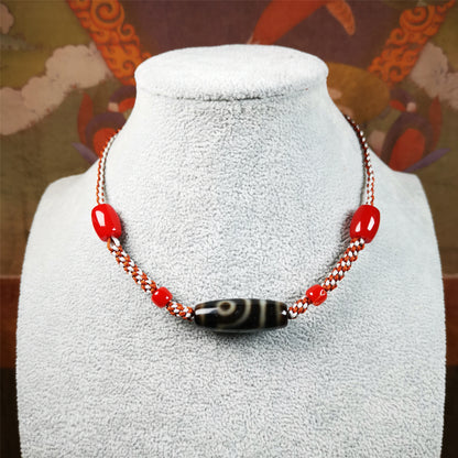 This necklace was hand-woven by Tibetans from Baiyu County, the main bead is a 2 eyed dzi bead, paired with agate beads,about 30 years old. It can be worn as a fashionable accessory, also holds cultural and religious significance.
