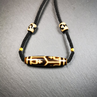 This necklace was hand-woven by Tibetans from Baiyu County, the main bead is a treasure vase dzi bead, paired with 3 eyed dzi beads,about 30 years old. It can be worn as a fashionable accessory, also holds cultural and religious significance.