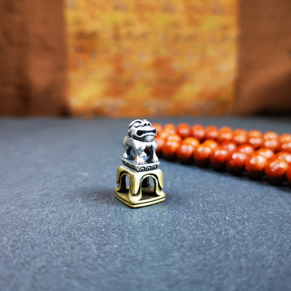 This tibetan snow lion seal was handmade from tibetan craftman. It is made of silver and brass,carved snow lion on the top and the Swastika symbol seal on the bottom,size is 0.9 inches.