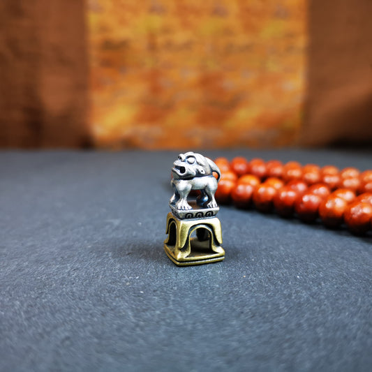 This tibetan snow lion seal was handmade from tibetan craftman. It is made of silver and brass,carved snow lion on the top and the Swastika symbol seal on the bottom,size is 0.9 inches.