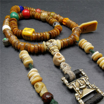 Gandhanra Authentic Tibetan Kapala Mala Necklace,Old Skull Bone Prayer Bead.This kapala mala was collected from Nyingma Kathok monastery, and has been passed down since the 1970's,used and blessed by lamas.
It's made according to traditional rituals, and accessories are gradually added,collection level.