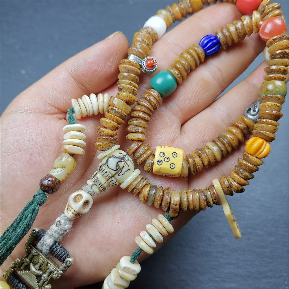 Gandhanra Authentic Tibetan Kapala Mala Necklace,Old Skull Bone Prayer Bead.This kapala mala was collected from Nyingma Kathok monastery, and has been passed down since the 1970's,used and blessed by lamas.
It's made according to traditional rituals, and accessories are gradually added,collection level.