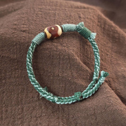 Hand Woven Bracelet with Fire Agate Tibetan 3 Eyes Mandala Dzi Beads - Tibetan dzi bead, front view