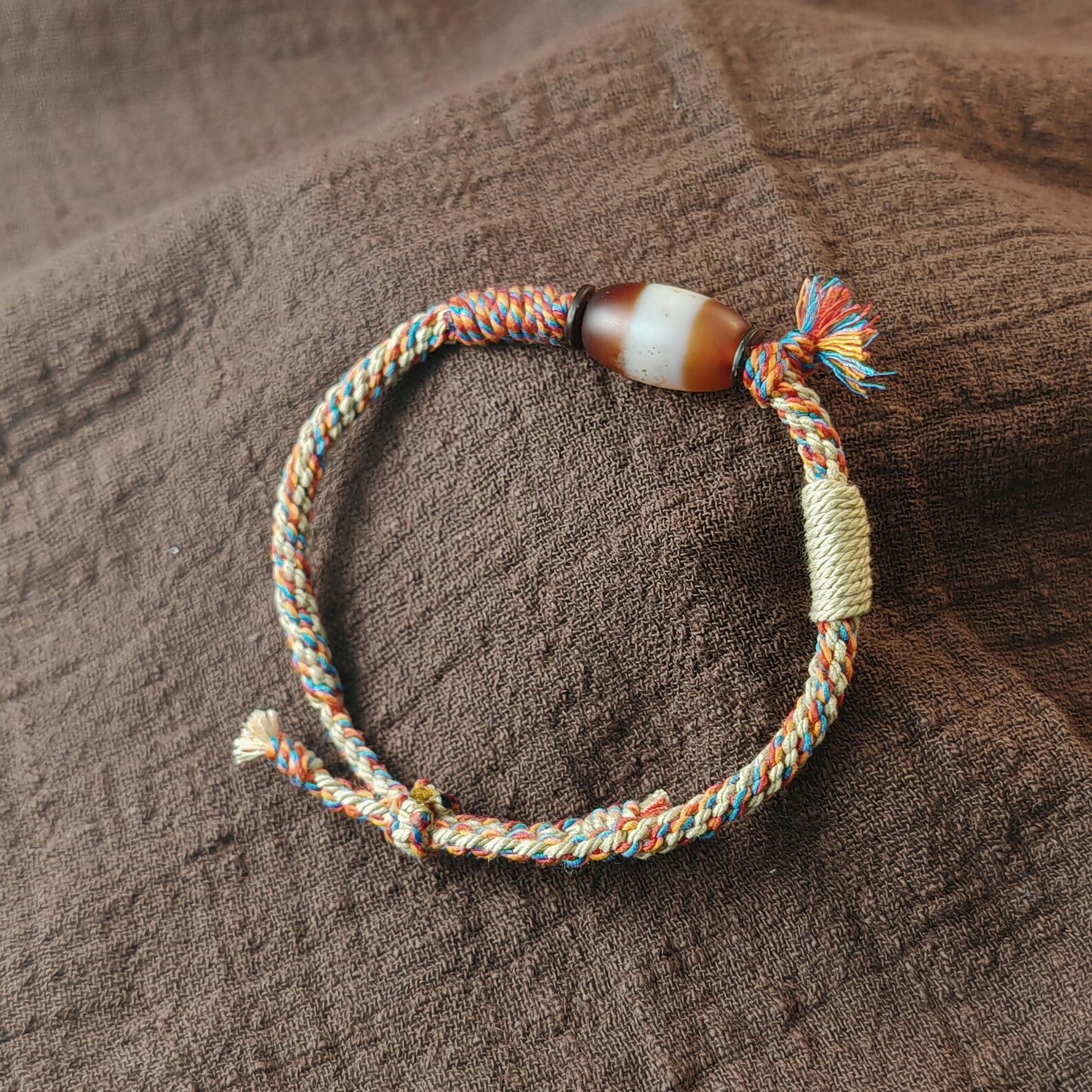 Jumlum Hand Woven Bracelet with Fire Agate Tibetan Stripe Dzi Beads